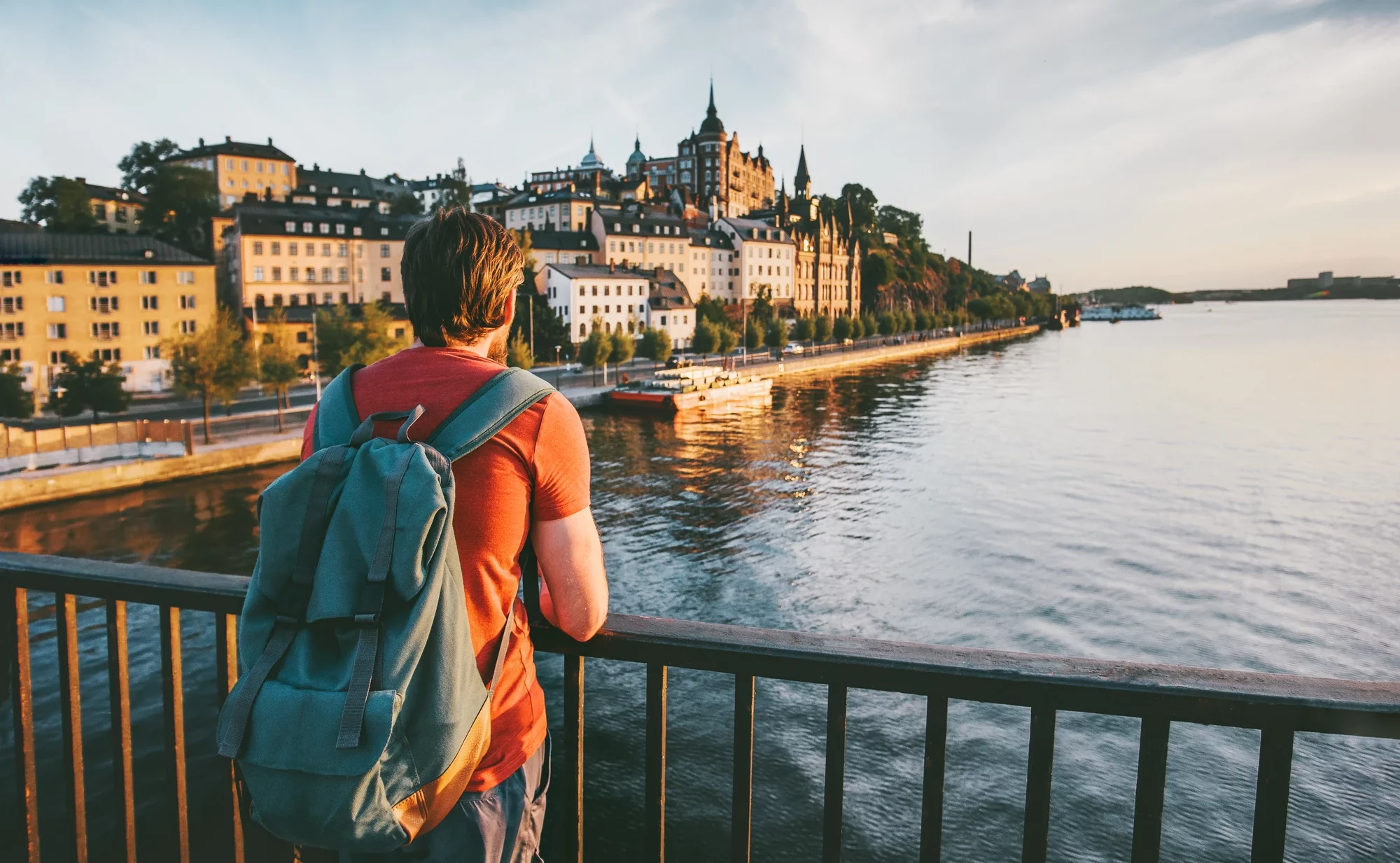 Tourist man sightseeing Stockholm city enjoying view traveling lifestyle summer vacations in Sweden