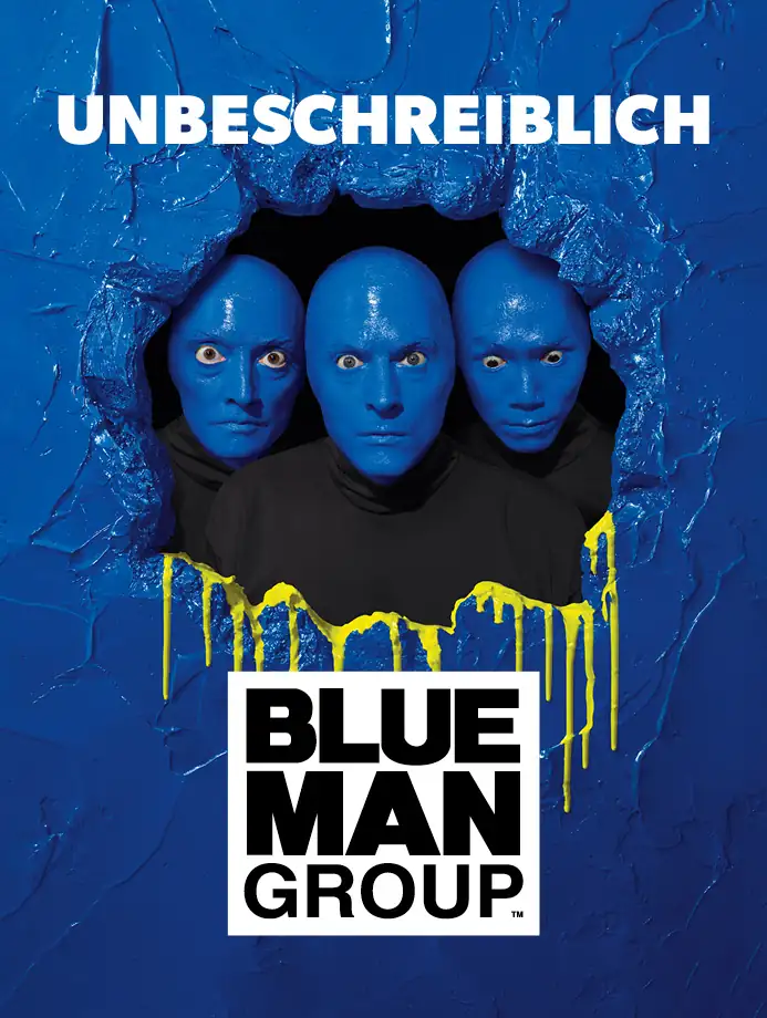 Drei blau bemalte Männerköpfe schauen durch ein Loch in einer blauen Wand mit gelben Farbspritzern, darüber steht 'UNBESCHREIBLICH', darunter das Logo 'BLUE MAN GROUP'