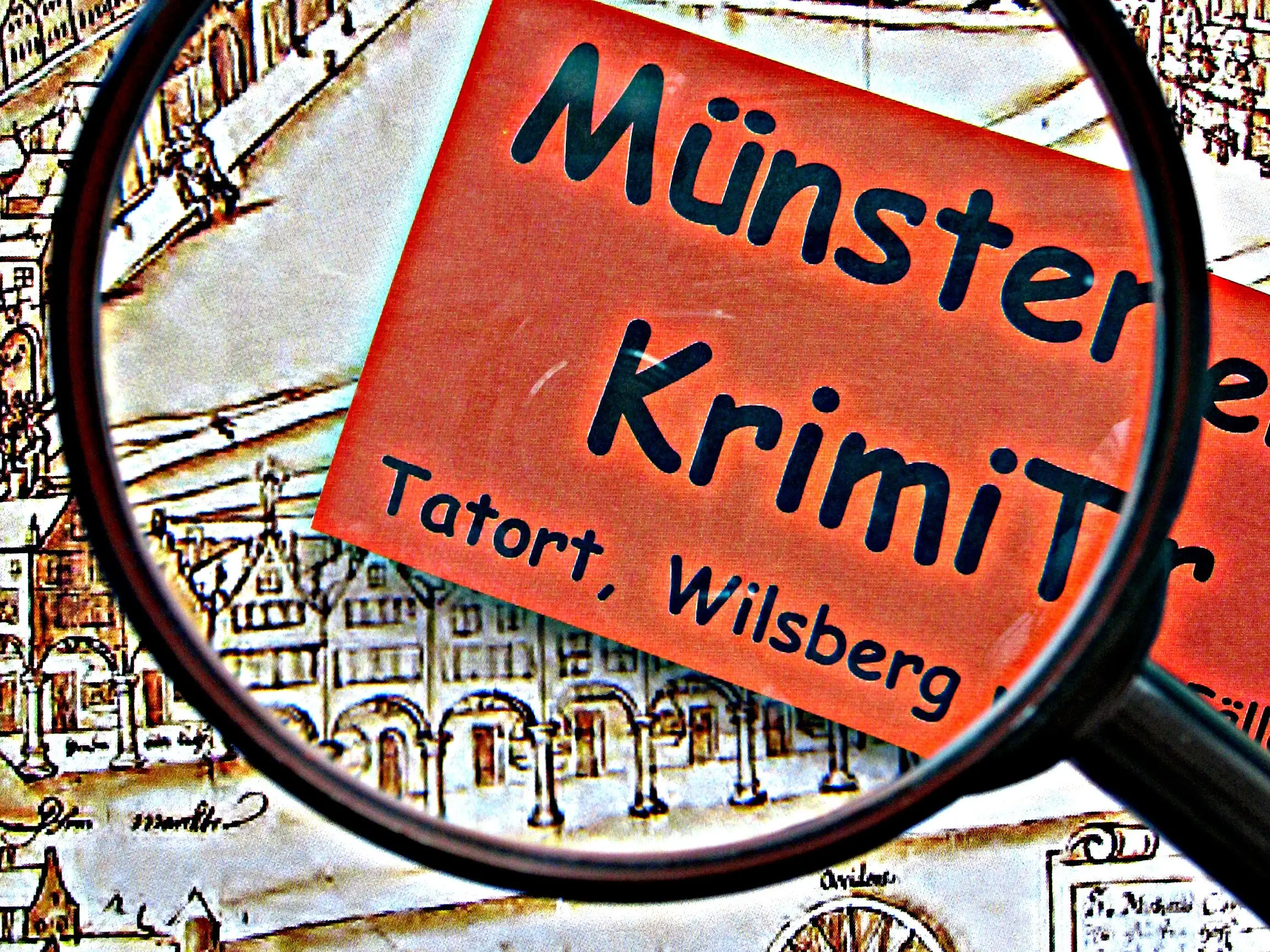 Logo Krimitour Münster durch eine Lupe Vergrößerung auf Münster, Krimi, Tatort und Wilsberg