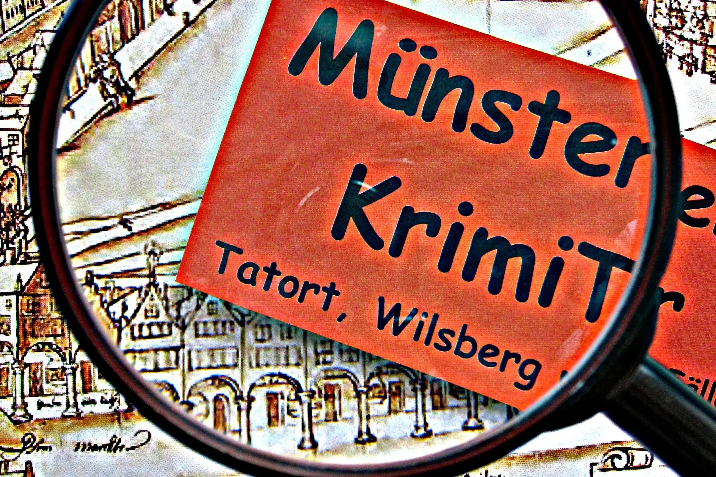 Logo Krimitour Münster durch eine Lupe Vergrößerung auf Münster, Krimi, Tatort und Wilsberg