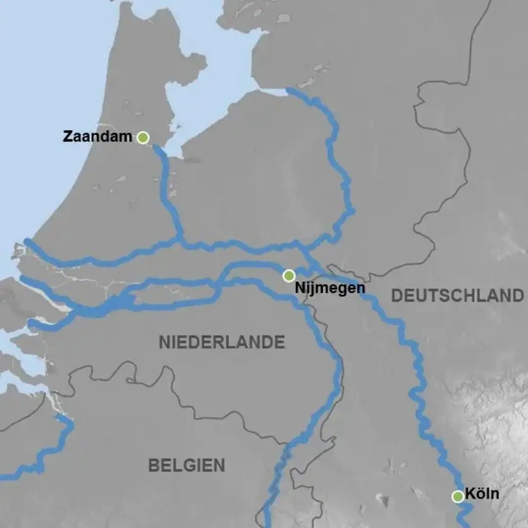 Karte zeigt Teile von Deutschland, Niederlande und Belgien mit Flüssen und den Städten Zaandam, Nijmegen und Köln markiert.